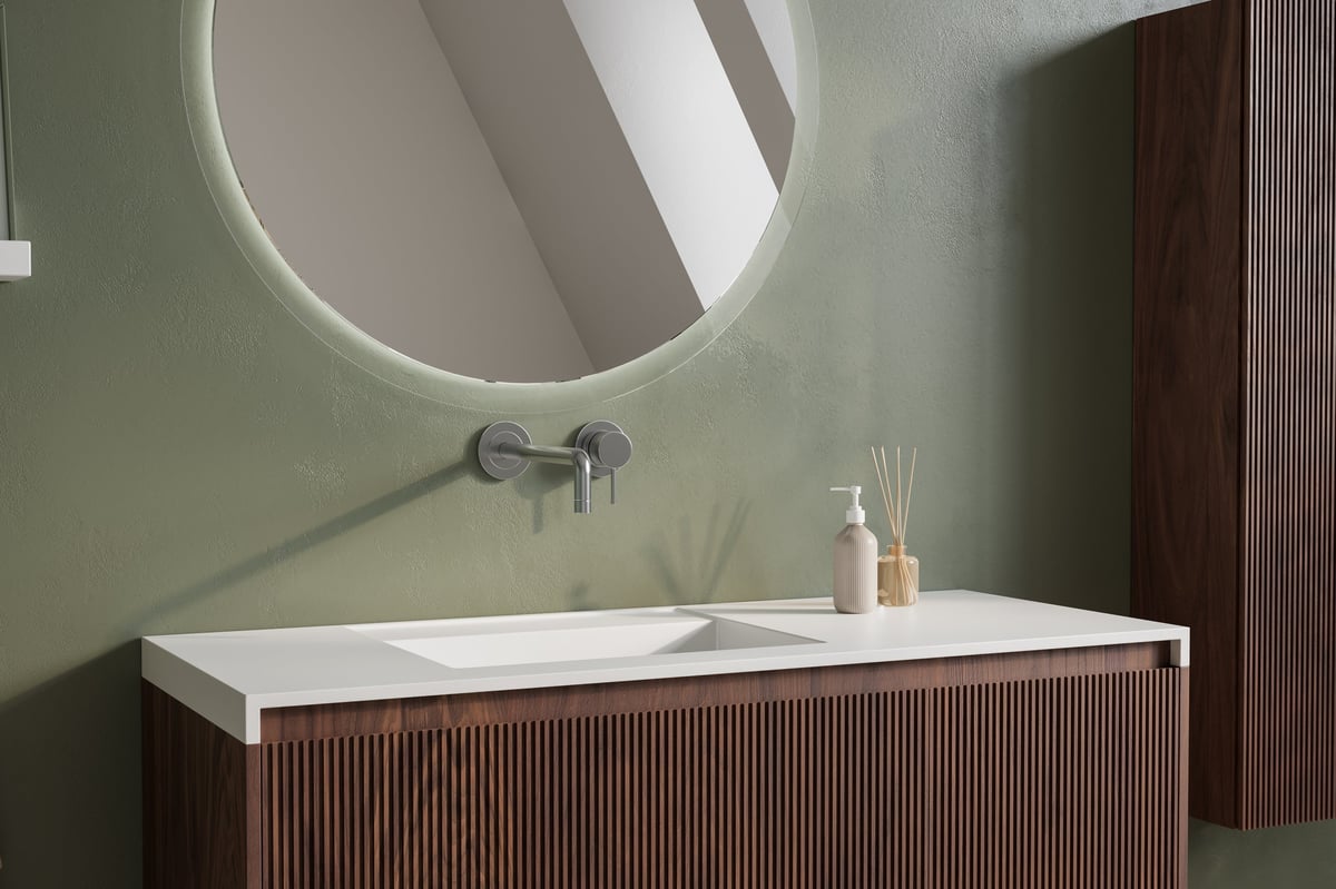 Close-up of a modern bathroom vanity with round mirror, wall mounted faucet, olive green wall, and ribbed wood cabinet. 3d render